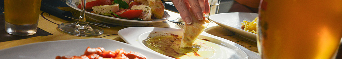Eating Greek Mediterranean at Marketplace Grille restaurant in San Diego, CA.